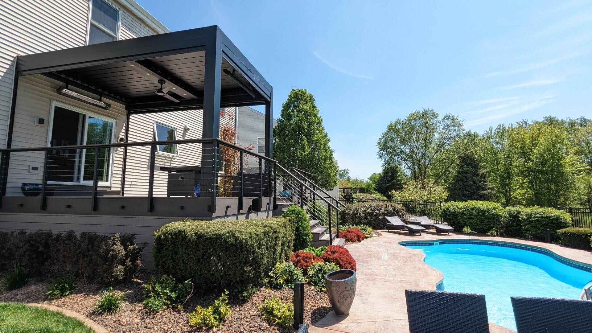 Louvered pergola with retractable screens and pool by Ace of Decks