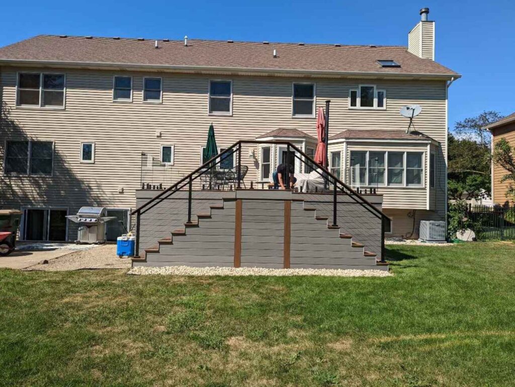 Raised composite deck with skirting and stairs