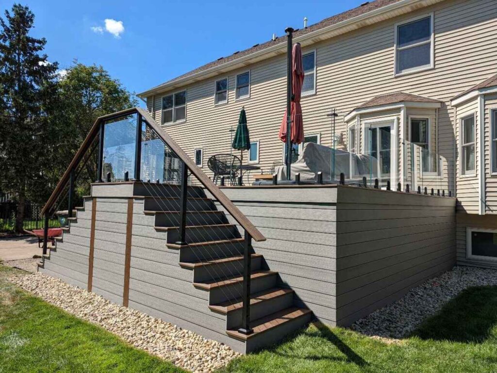 Tall composite deck with a skirted base and wide stairs