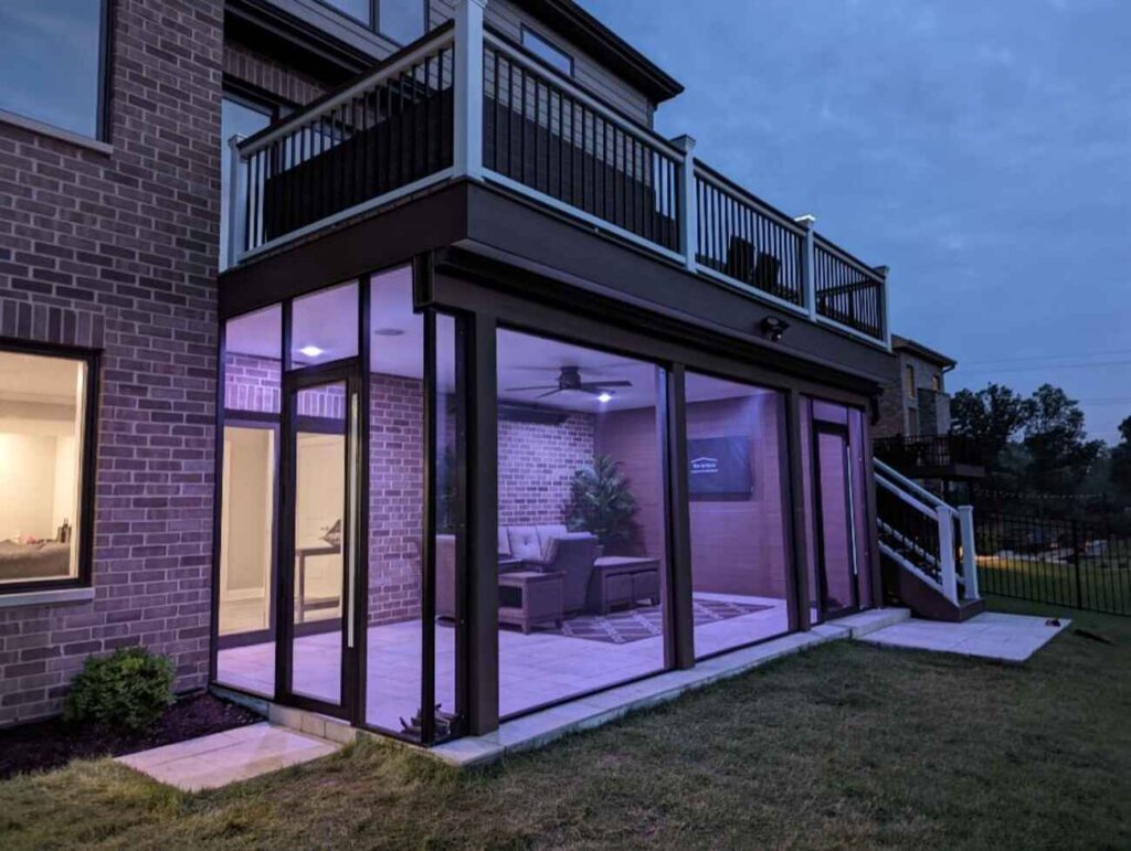 Under-deck room lit in the evening beneath an upper deck