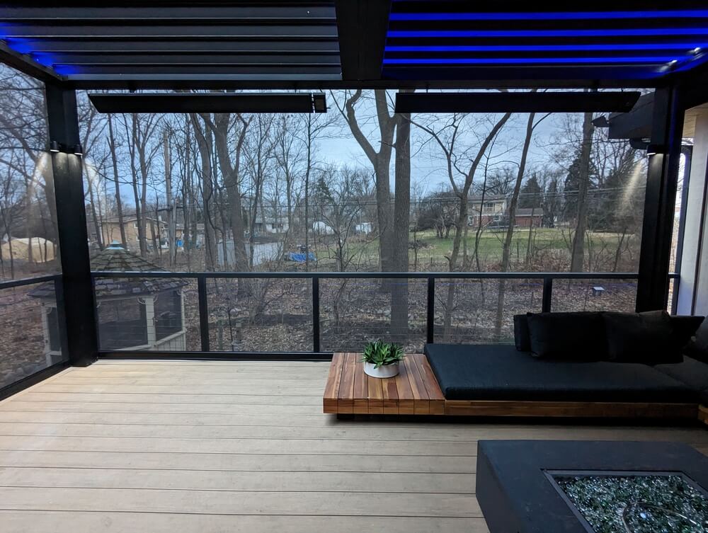 Louvered roof with LED lighting over a deck lounge