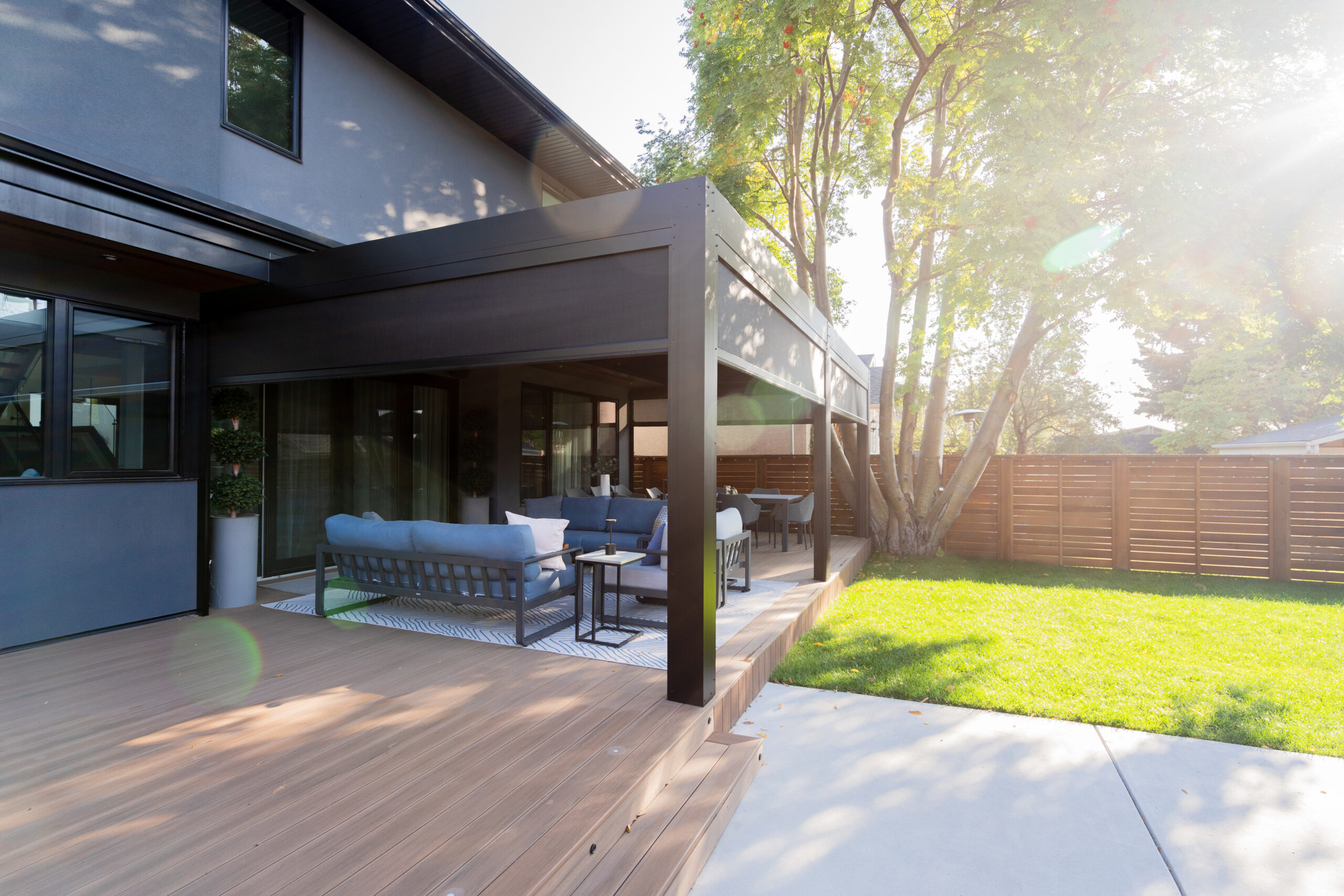 Retractable power screens integrated with louvered pergola by Ace of Decks