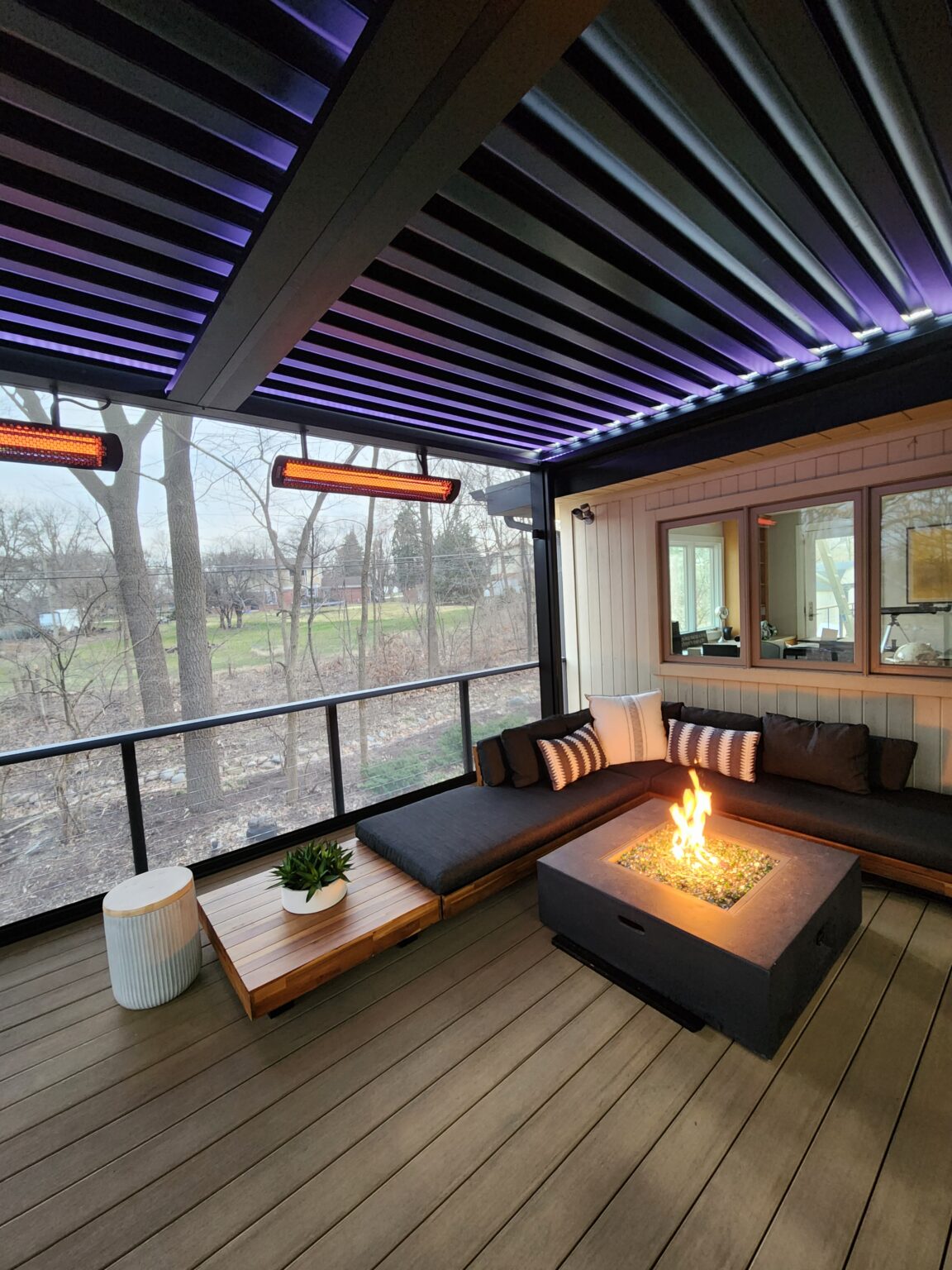 Louvered roof with LED lighting over a deck sitting area