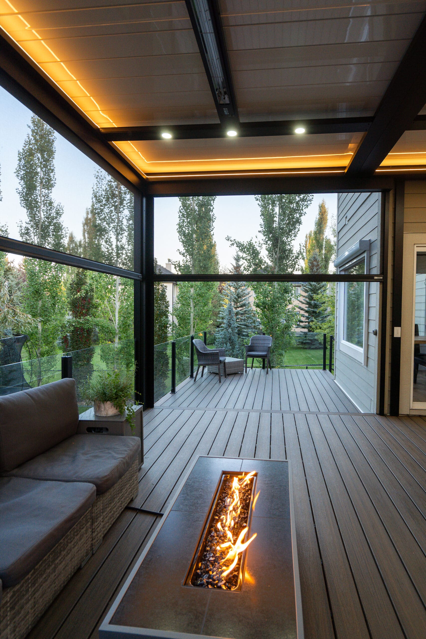 Outdoor living space with louvered pergola by Ace of Decks Chicago suburbs