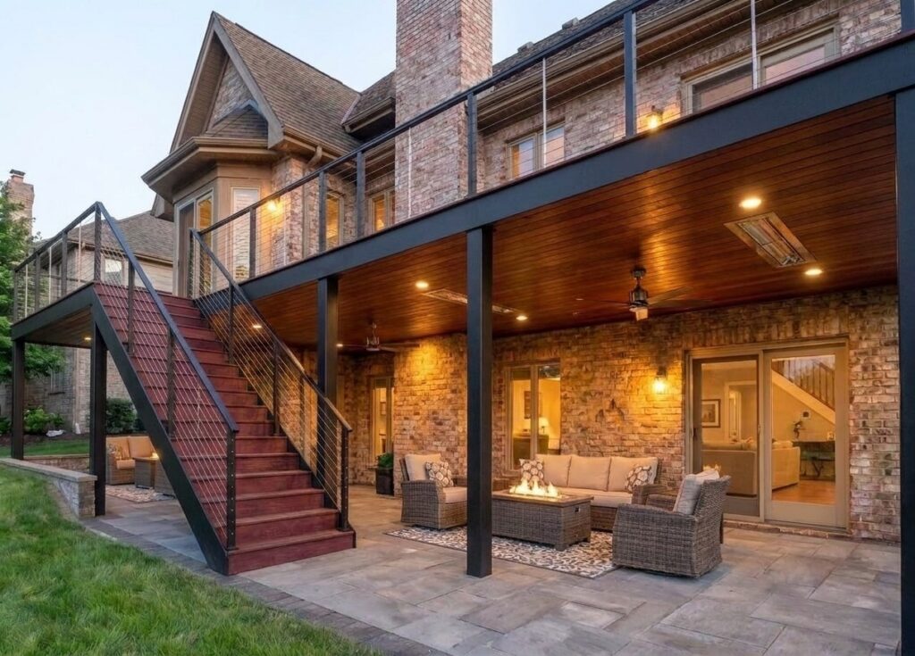 3D design rendering looking along a covered deck with recessed ceiling lighting and glass railing