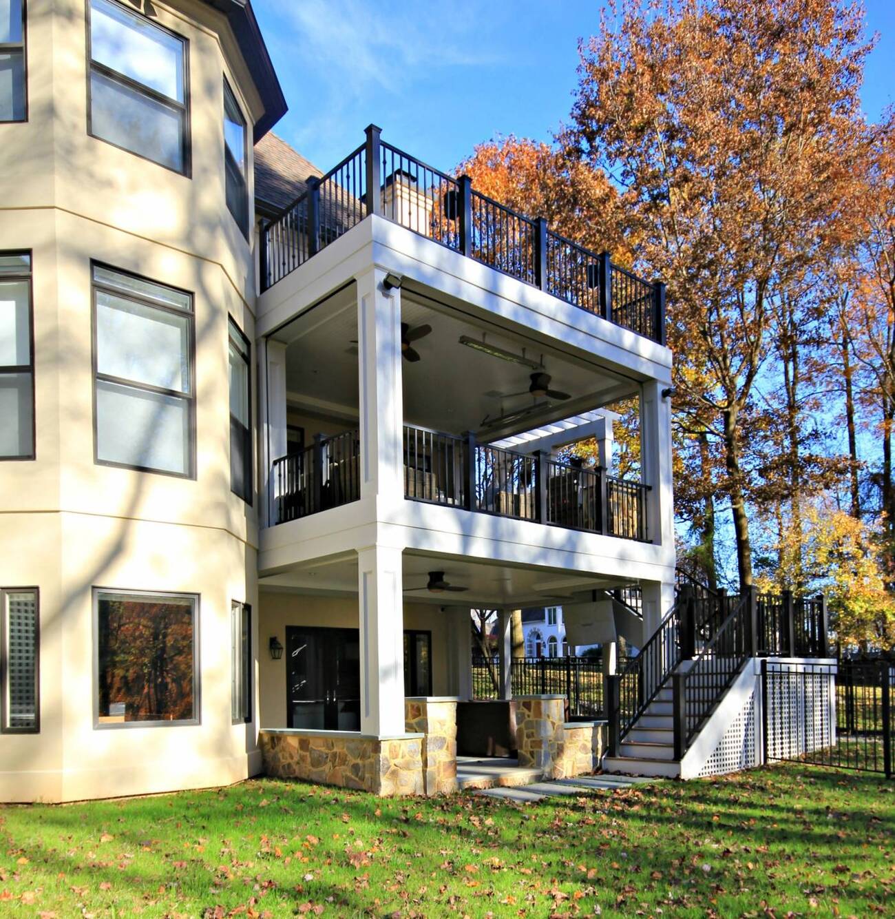 Second story deck and waterproof outdoor living space by Ace of Decks